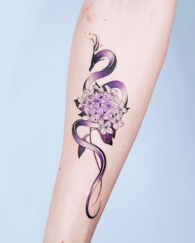 Purple dragon and daphnes for girls by @e.nal_.tattoo- best dragon tattoos for women and girls